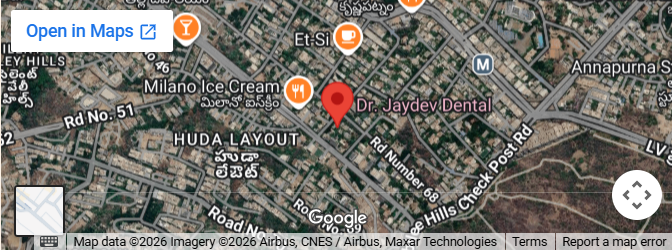 Map view highlighting a red pin near 'Dr. Jaydev Dental' in the HUDA Layout area, showing surrounding streets and the 'Open in Maps' button.